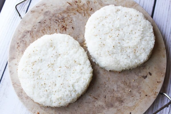 round sushi rice cakes on a ceramic board