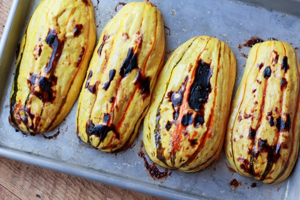roasted delicata squash on a baking tray