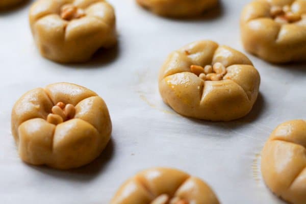 close up of raw pumpkin cookies on parchment ready to be baked