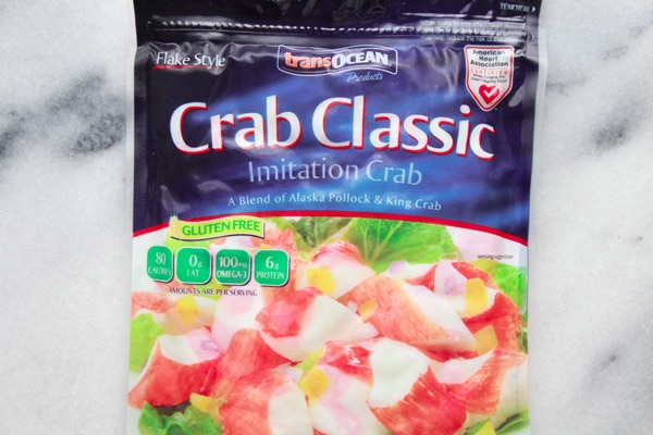 imitation crab A bag of TransOcean Crab Classic imitation crab on top of a marble surface.