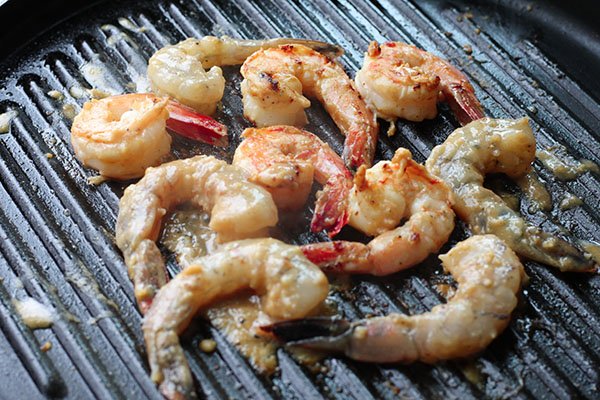 Grilled Miso Shrimp Shrimp being grilled on a grill pan.