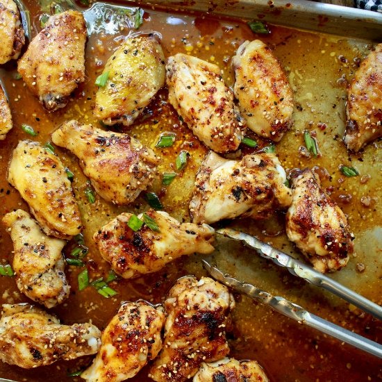 baked Korean chicken wings on a baking sheet right out of the oven