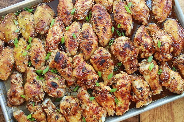 baked Korean chicken wings baked Korean chicken wings on a baking sheet right out of the oven