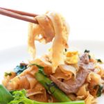 Thai Pad See Ew stir fried noodles with chopsticks
