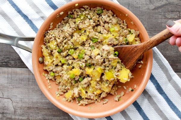 acorn squash stuffing in a saute pan.