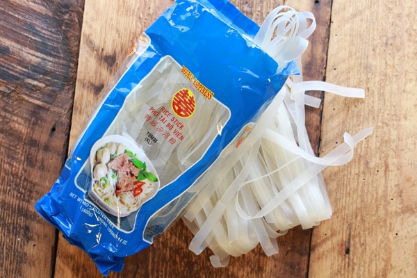 rice noodles Asian rice noodles in the package on a wooden board.