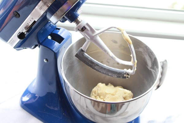 dough for Chinese almond cookies Chinese almond cookie dough in a blue stand mixer.
