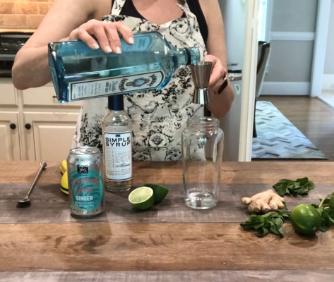 making a minty ginger fizz cocktail with Bombay gin