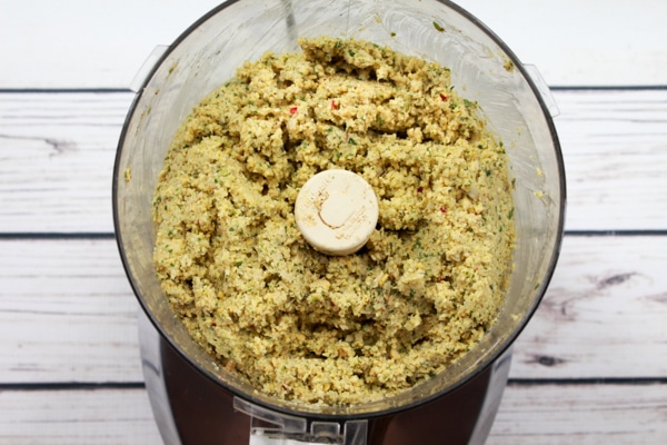 falafel mix paste in a food processor on a white board