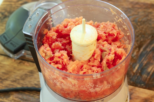 wild salmon being pulsed in a food processor