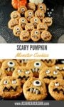 pumpkin monster cookies on a black place mat with baby pumpkins