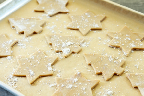sugar cookie holiday cutouts on a baking sheet