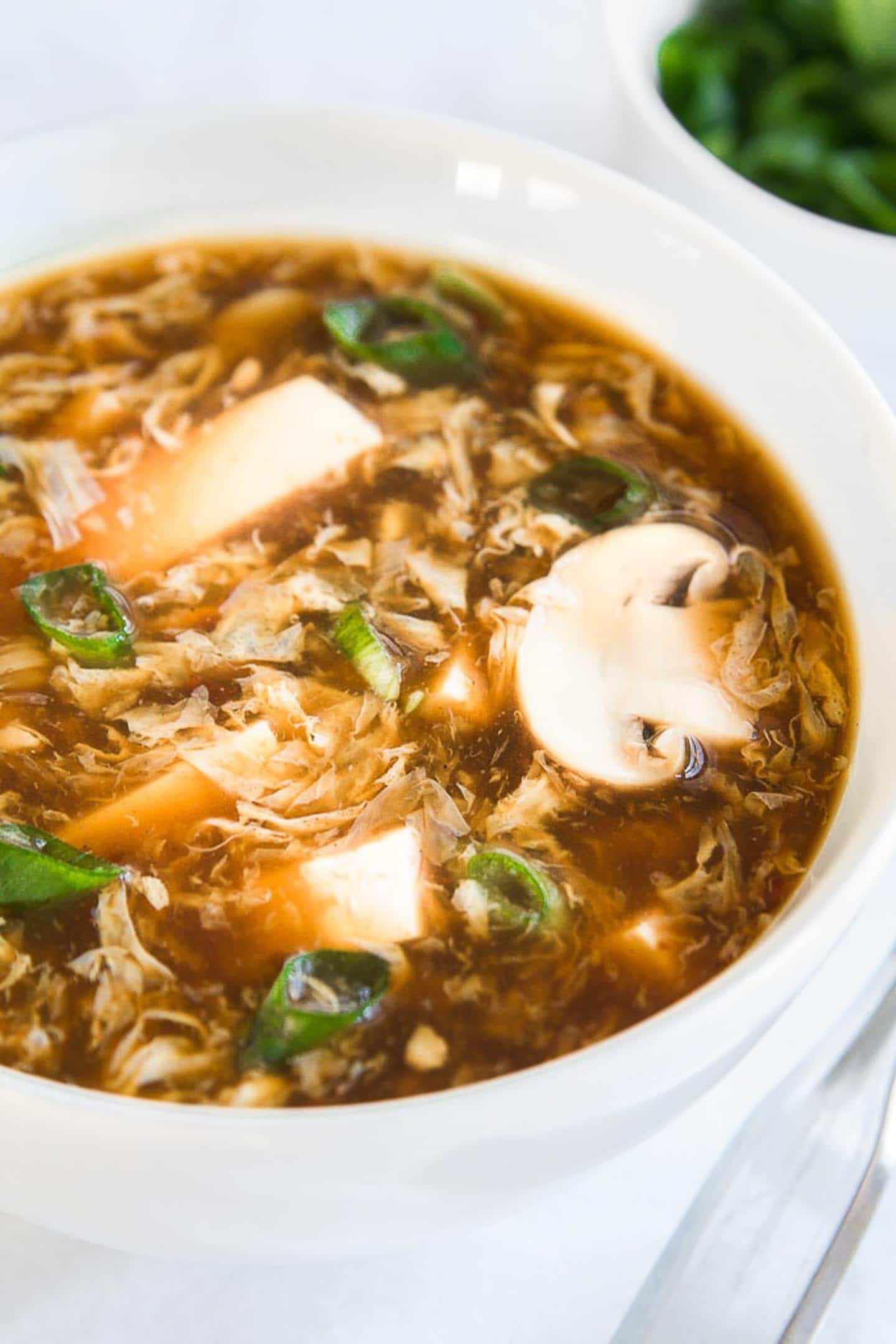 hot and sour soup in a white bowl