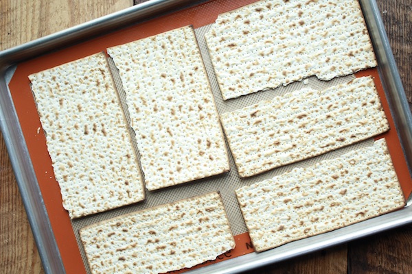 pieces of matzo on a baking tray