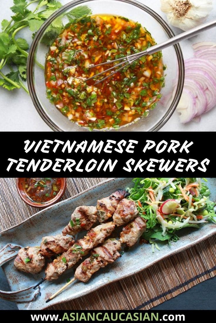 pork tenderloin skewers on a platter with a side salad and dipping sauce