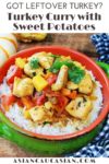 a bright green bowl filled with turkey curry over white rice on a wooden board