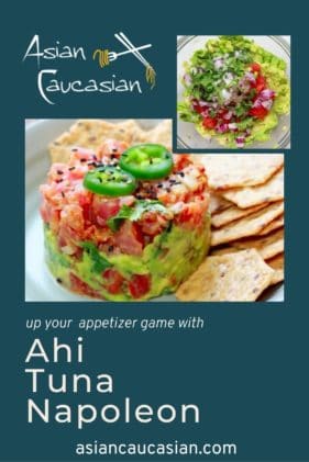 Vibrant Ahi tuna napoleon topped with jalapeño slices on a plate with sesame chips on the side.