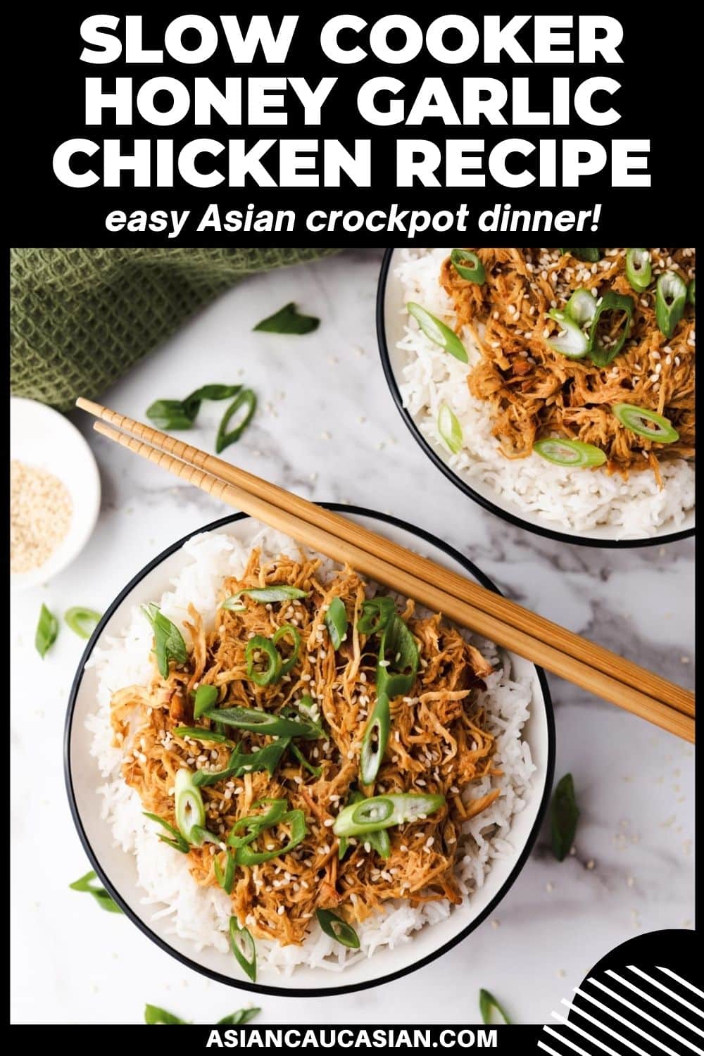 Slow cooker honey garlic chicken over white rice topped with sliced scallions placed in two white bowls with a pair of chopsticks on top and a small bowl of sesame seeds and a green napkin on the side, on top of a marble surface.