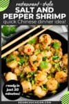 Chinese salt and pepper shrimp in a black bowl with sautéed vegetables and herbs, and a pair of chopsticks on top on a gray surface with a gray linen on the side.